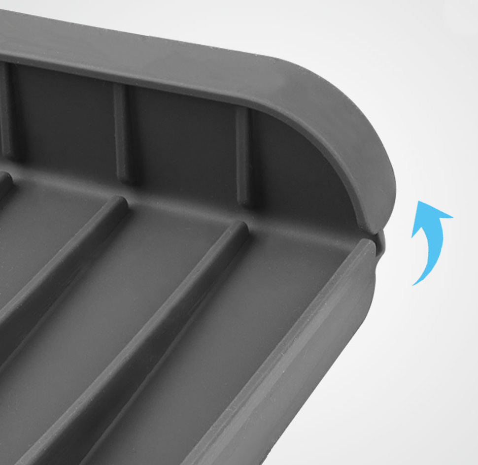 Close-up of the silicone faucet drip catcher tray showing its adjustable backrest and fold-up direction
