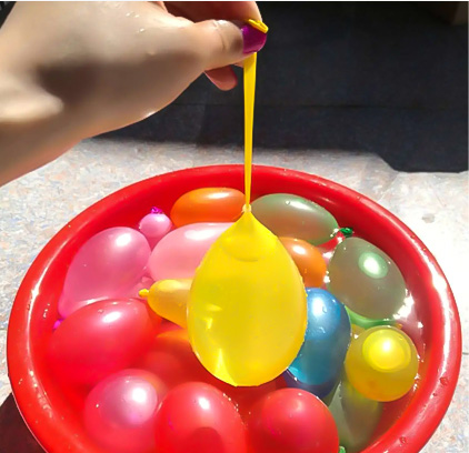 Filling a water balloon with water